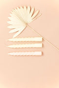 Set of spiral candles in light vanilla
